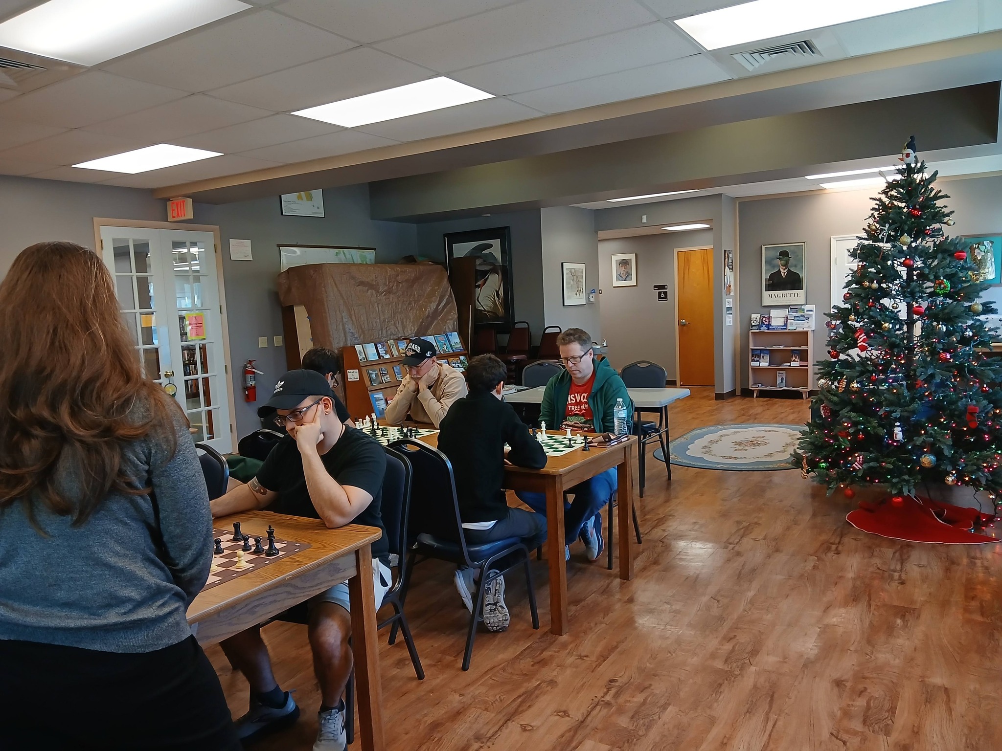 Group of players analyzing positions during Flagler County chess meetup