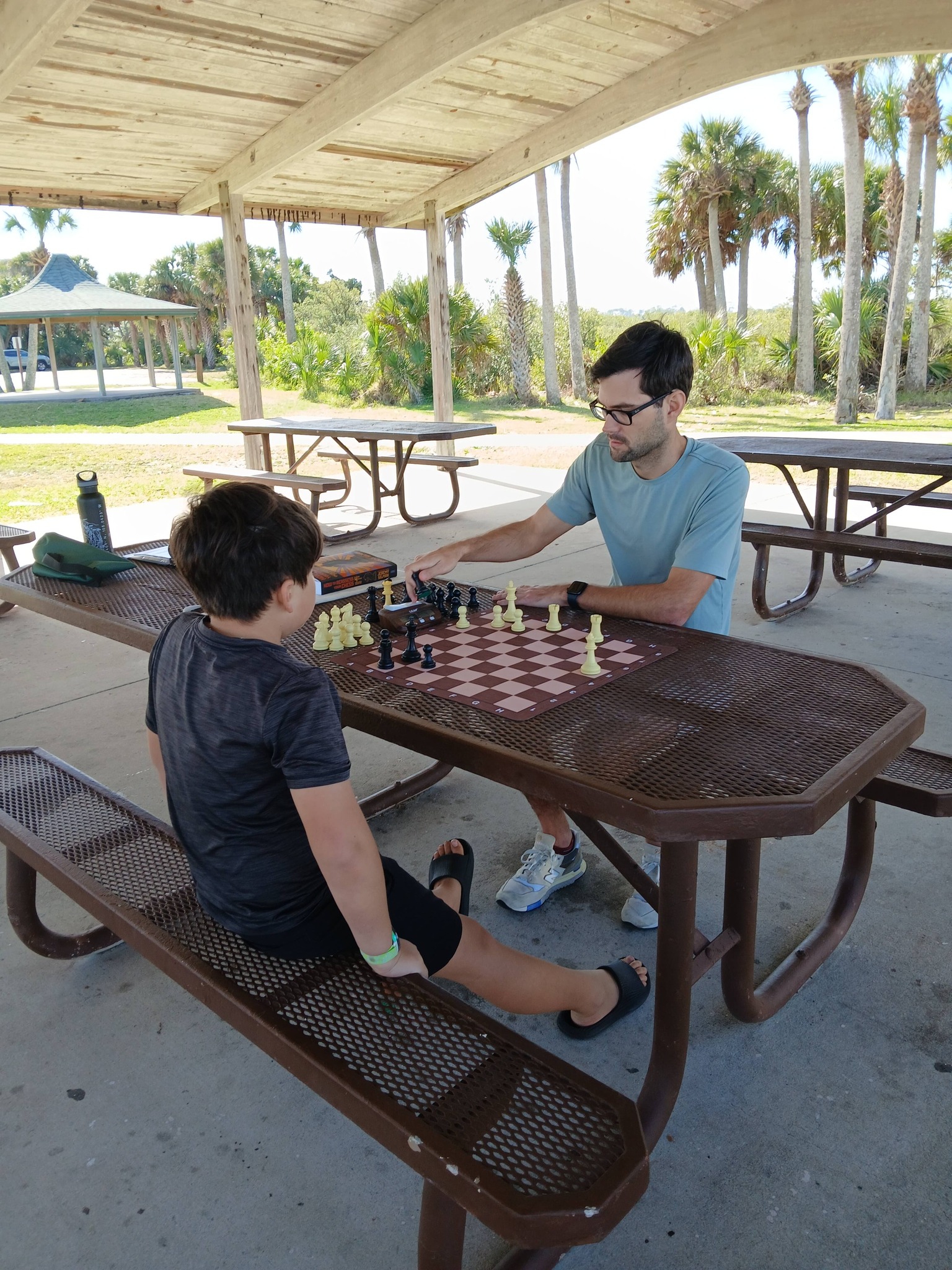 Players gathered around chess boards at Flagler County meetup